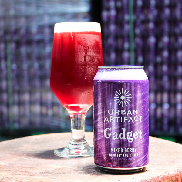 An enticing can of Gadget Mixed Berry Fruit Tart remarkable liquid poured into a beautiful glass. Vibrant colors and captivating flavors in every sip.